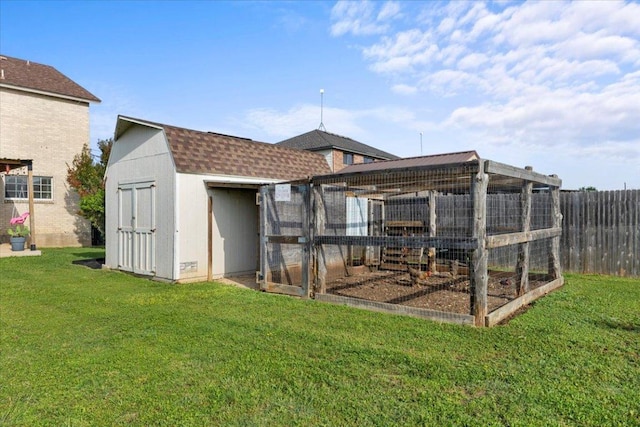 100 N Prairie Ln, Georgetown, TX 78633 - rear view of property with an outbuilding, exterior structure, a shingled roof, and a gambrel roof