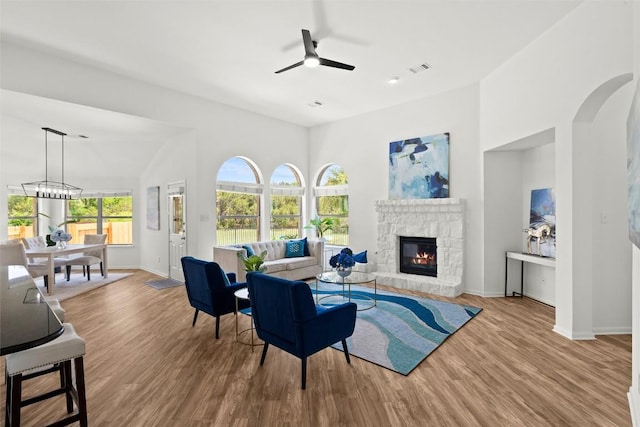 270 Harris Dr, Austin, TX 78737 - living area with ceiling fan, baseboards, wood finished floors, a fireplace, and a high ceiling