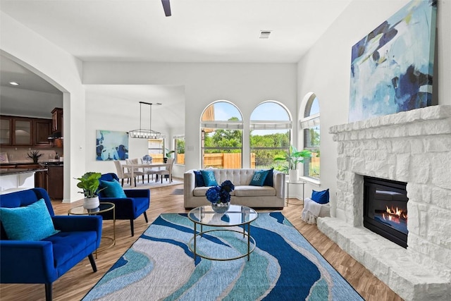 270 Harris Dr, Austin, TX 78737 - living area featuring a stone fireplace and light wood finished floors