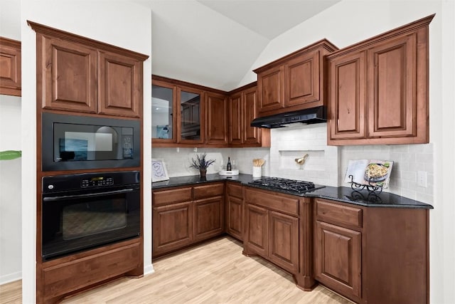270 Harris Dr, Austin, TX 78737 - kitchen featuring black appliances, under cabinet range hood, backsplash, light wood-type flooring, and lofted ceiling