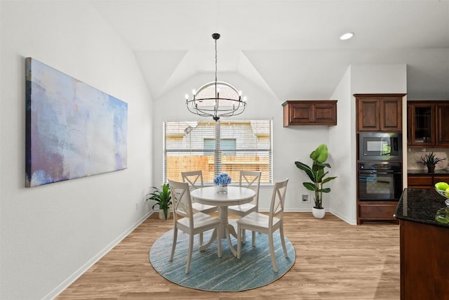 270 Harris Dr, Austin, TX 78737 - dining space with a chandelier, vaulted ceiling, light wood-style floors, and baseboards