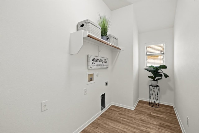 270 Harris Dr, Austin, TX 78737 - washroom featuring hookup for an electric dryer, hookup for a washing machine, baseboards, and wood finished floors