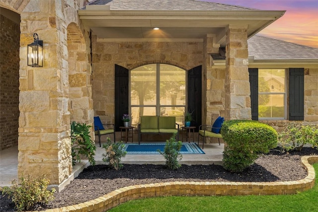 270 Harris Dr, Austin, TX 78737 - entrance to property featuring a shingled roof, stone siding, and a porch