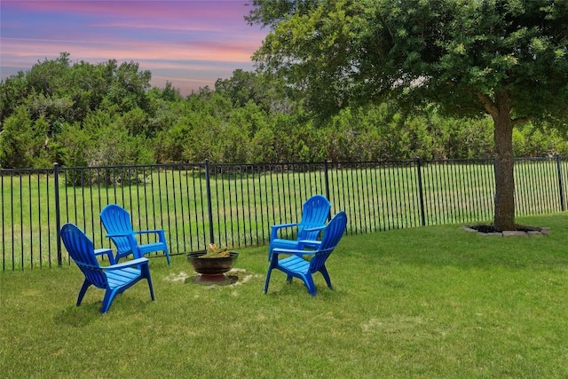 270 Harris Dr, Austin, TX 78737 - yard at dusk with an outdoor fire pit