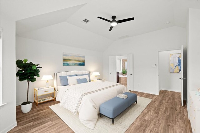 270 Harris Dr, Austin, TX 78737 - bedroom featuring lofted ceiling, wood finished floors, baseboards, ceiling fan, and connected bathroom