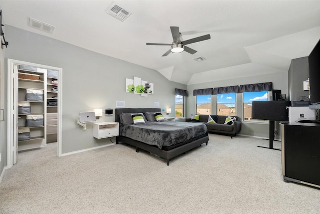 1312 Backcountry Dr, Leander, TX 78641 - carpeted bedroom featuring a walk in closet, baseboards, vaulted ceiling, ceiling fan, and a desk