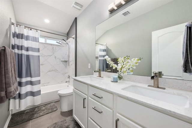 1312 Backcountry Dr, Leander, TX 78641 - full bathroom featuring double vanity, toilet, shower / bath combo, and tile patterned flooring
