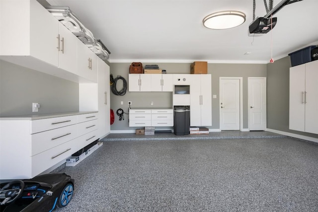 1312 Backcountry Dr, Leander, TX 78641 - garage featuring a garage door opener and baseboards