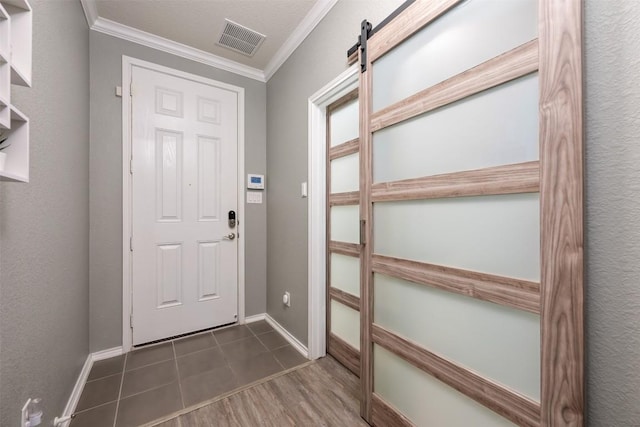 1312 Backcountry Dr, Leander, TX 78641 - entryway featuring crown molding, baseboards, and dark wood finished floors