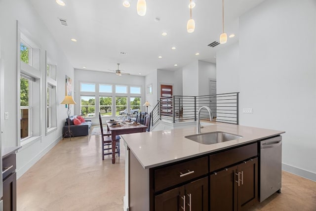 1402 E 11th St, Austin, TX 78702 - kitchen featuring a sink, stainless steel dishwasher, open floor plan, dark brown cabinets, and recessed lighting