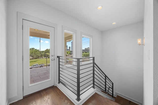1402 E 11th St, Austin, TX 78702 - doorway to outside featuring dark wood finished floors and recessed lighting