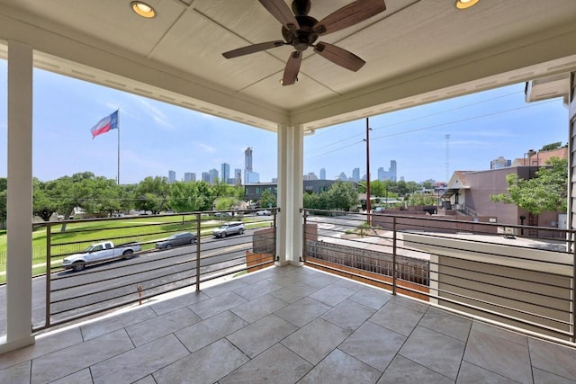 1402 E 11th St, Austin, TX 78702 - view of patio featuring a view of skyline, ceiling fan, and a balcony