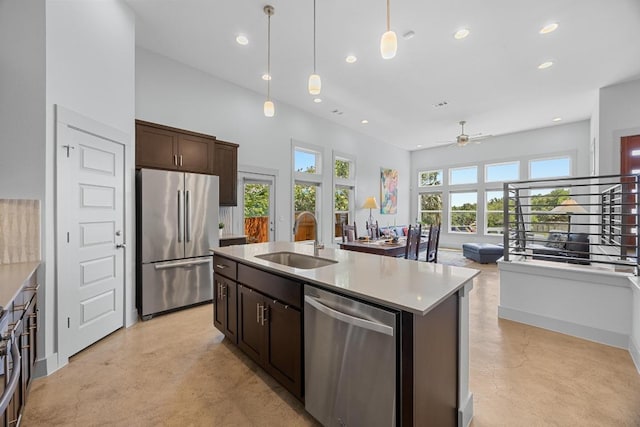 1402 E 11th St, Austin, TX 78702 - kitchen featuring appliances with stainless steel finishes, a sink, finished concrete flooring, ceiling fan, and recessed lighting