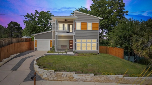 1402 E 11th St, Austin, TX 78702 - contemporary home featuring a balcony, concrete driveway, a ceiling fan, and a garage
