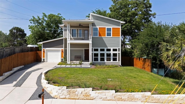 1402 E 11th St, Austin, TX 78702 - view of front of home featuring a balcony, concrete driveway, and ceiling fan