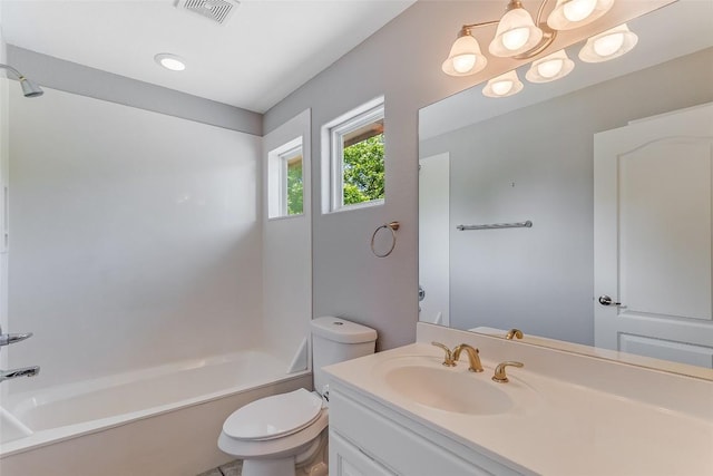bathroom with vanity, toilet, bathing tub / shower combination, and a chandelier