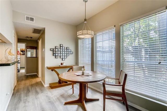 700 S 1st St S Unit 101, Austin, TX 78704 - dining area with light wood finished floors and baseboards