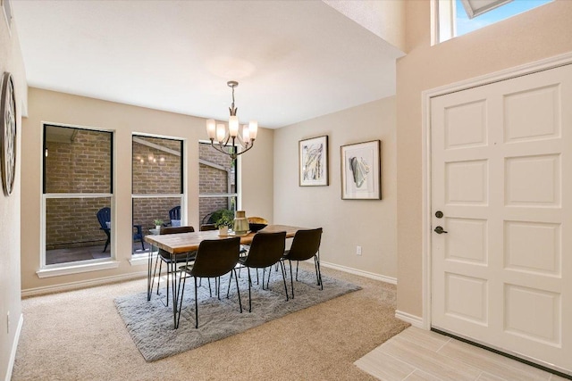 4117 Ridgeline Dr, Austin, TX 78731 - dining area featuring light colored carpet, a chandelier, and baseboards