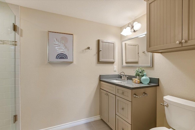 4117 Ridgeline Dr, Austin, TX 78731 - bathroom featuring toilet, vanity, tiled shower, tile patterned flooring, and baseboards