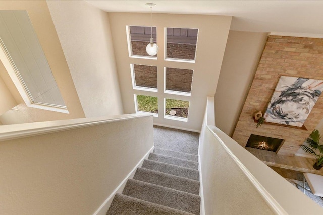 4117 Ridgeline Dr, Austin, TX 78731 - staircase featuring carpet and baseboards