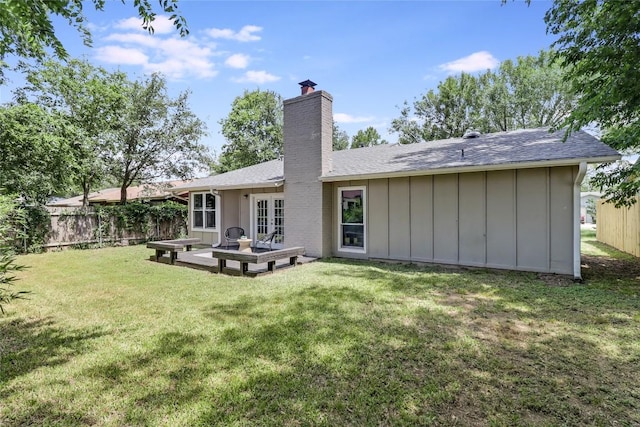 2603 Carlow Dr, Austin, TX 78745 - back of property with a chimney, french doors, board and batten siding, and a shingled roof