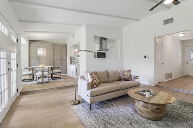 2603 Carlow Dr, Austin, TX 78745 - living room with light wood-style floors, ceiling fan, and baseboards