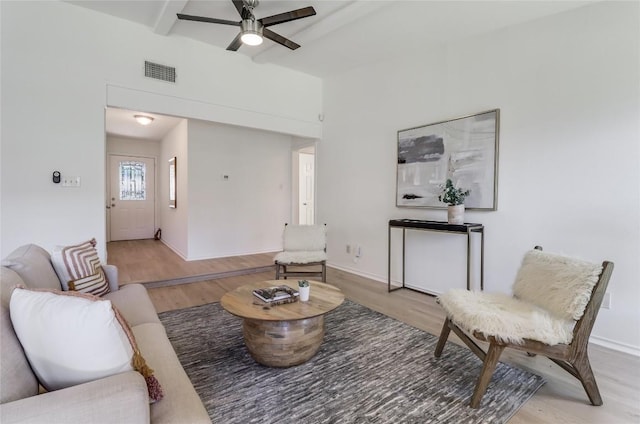 2603 Carlow Dr, Austin, TX 78745 - living area featuring light wood-type flooring, beamed ceiling, baseboards, and ceiling fan
