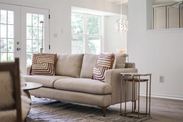 2603 Carlow Dr, Austin, TX 78745 - living area with wood finished floors, a chandelier, and baseboards