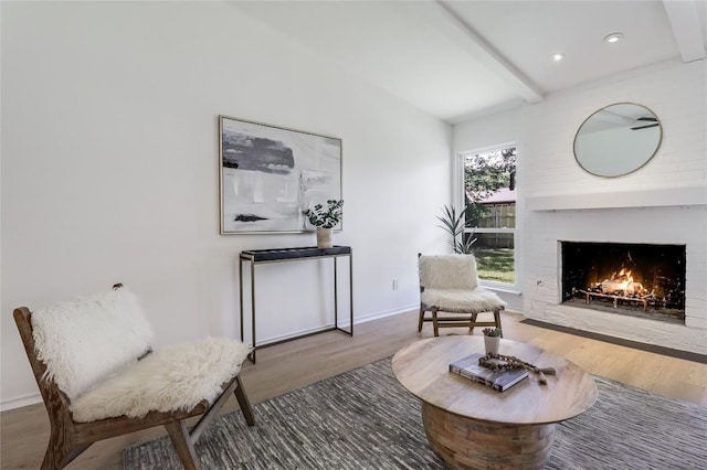 2603 Carlow Dr, Austin, TX 78745 - living room with wood finished floors, a fireplace, beamed ceiling, baseboards, and recessed lighting