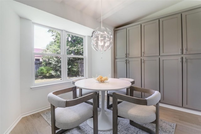2603 Carlow Dr, Austin, TX 78745 - dining room featuring a chandelier, lofted ceiling, and light wood-style floors
