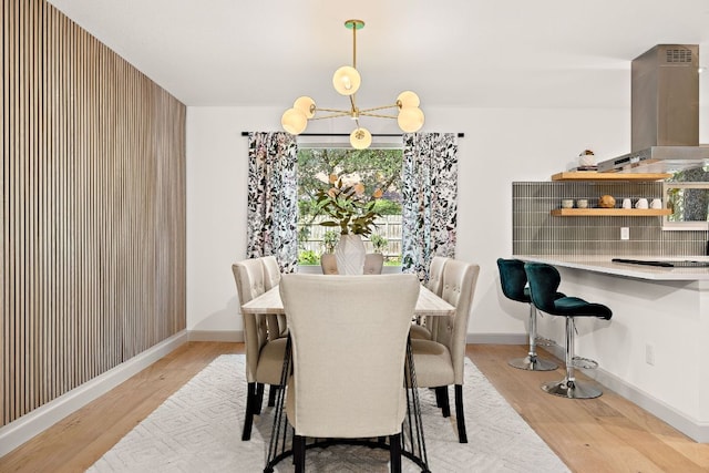 11008 Arch Ter, Austin, TX 78750 - dining room featuring light wood-style floors and a chandelier
