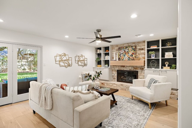 11008 Arch Ter, Austin, TX 78750 - living area featuring a ceiling fan, light wood-type flooring, recessed lighting, a fireplace, and built in features