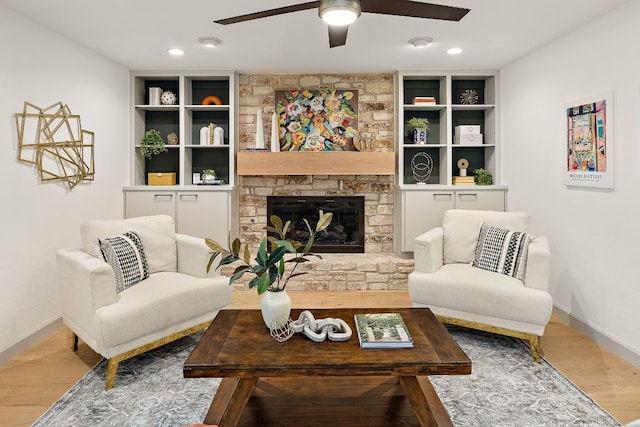11008 Arch Ter, Austin, TX 78750 - living room with a ceiling fan, wood finished floors, baseboards, a fireplace, and recessed lighting