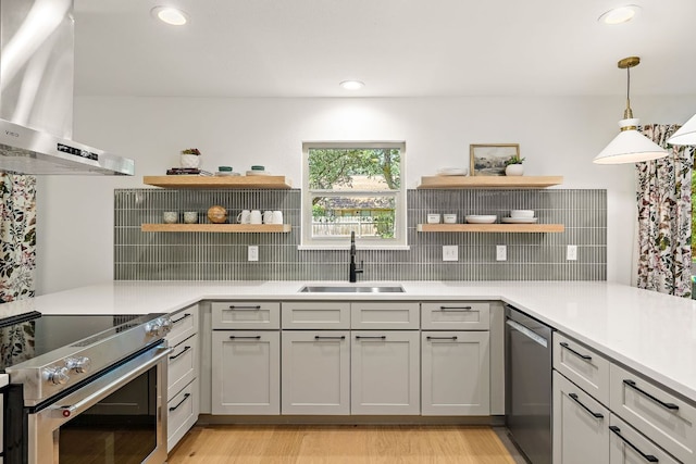 11008 Arch Ter, Austin, TX 78750 - kitchen with open shelves, a sink, stainless steel appliances, wall chimney exhaust hood, and recessed lighting