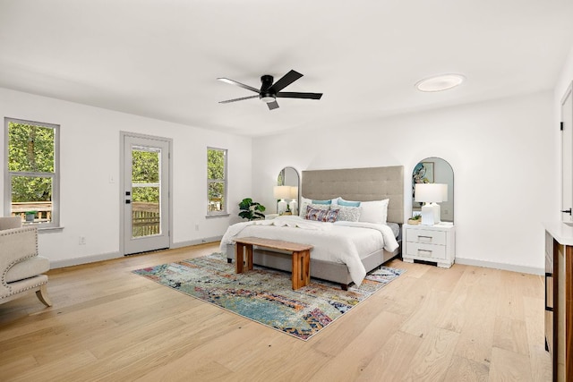 11008 Arch Ter, Austin, TX 78750 - bedroom featuring access to exterior, light wood-style floors, and multiple windows