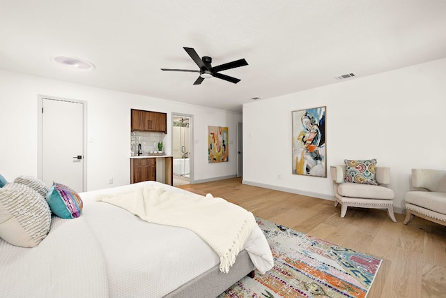 11008 Arch Ter, Austin, TX 78750 - bedroom with light wood-style floors, baseboards, and ceiling fan