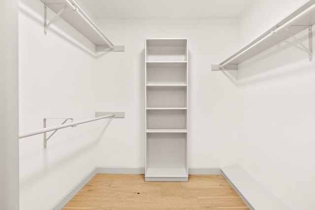 11008 Arch Ter, Austin, TX 78750 - walk in closet with wood finished floors