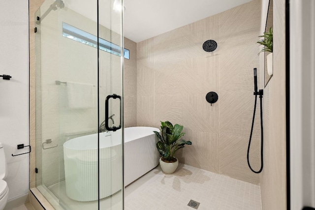 11008 Arch Ter, Austin, TX 78750 - full bathroom featuring a shower stall, toilet, and a freestanding tub