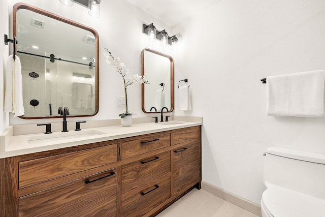 11008 Arch Ter, Austin, TX 78750 - bathroom with double vanity, a shower stall, toilet, and baseboards