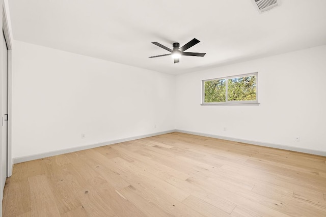 11008 Arch Ter, Austin, TX 78750 - spare room featuring light wood-type flooring, a ceiling fan, and baseboards