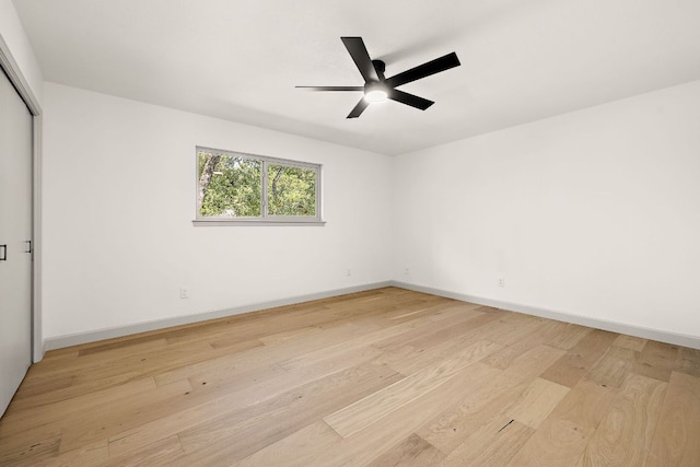 11008 Arch Ter, Austin, TX 78750 - unfurnished room with light wood finished floors, a ceiling fan, and baseboards