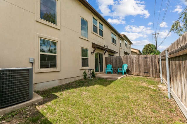 1701 S Bell Blvd Unit 101, Cedar Park, TX 78613 - rear view of property with central air condition unit, stucco siding, and a patio
