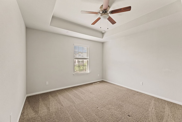 1701 S Bell Blvd Unit 101, Cedar Park, TX 78613 - carpeted empty room featuring a ceiling fan, baseboards, and a raised ceiling