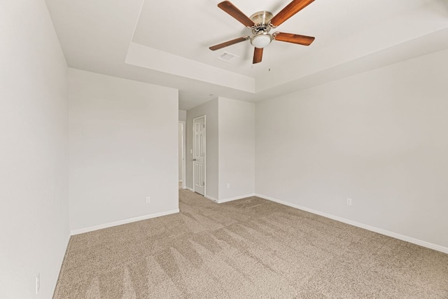 1701 S Bell Blvd Unit 101, Cedar Park, TX 78613 - empty room with a raised ceiling, carpet floors, ceiling fan, and baseboards