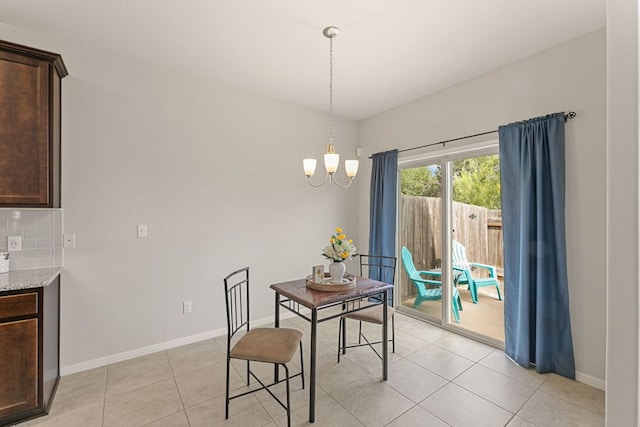 1701 S Bell Blvd Unit 101, Cedar Park, TX 78613 - dining space with a chandelier, baseboards, and light tile patterned floors