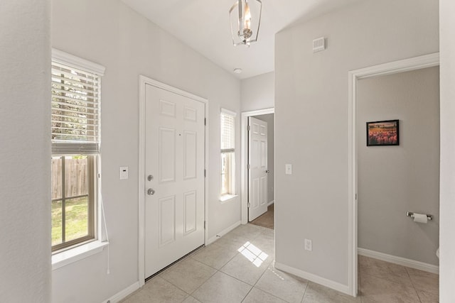 1701 S Bell Blvd Unit 101, Cedar Park, TX 78613 - entryway with light tile patterned floors and baseboards