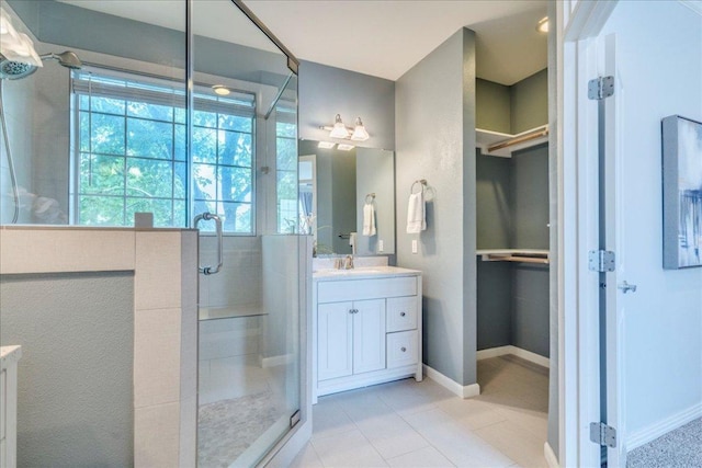 2115 Bluebonnet Ln Unit 3B, Austin, TX 78704 - bathroom with vanity, a stall shower, and a walk in closet