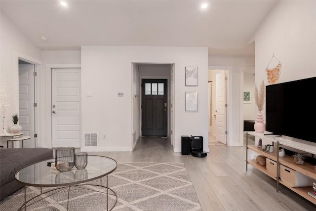 4601 Candletree Ln, Austin, TX 78744 - living area featuring light wood-style floors, baseboards, and recessed lighting