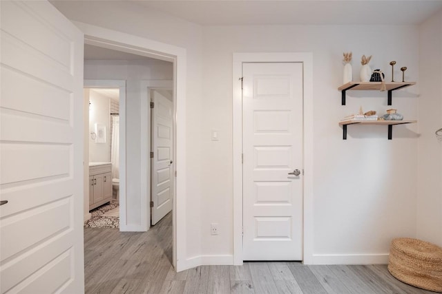 4601 Candletree Ln, Austin, TX 78744 - hall with light wood-style flooring and baseboards
