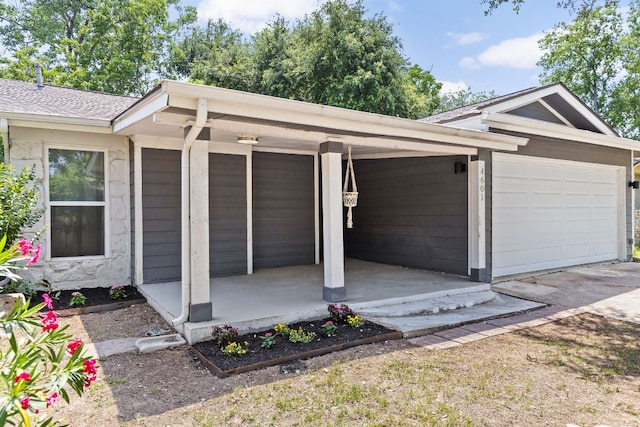 4601 Candletree Ln, Austin, TX 78744 - garage with driveway and covered porch